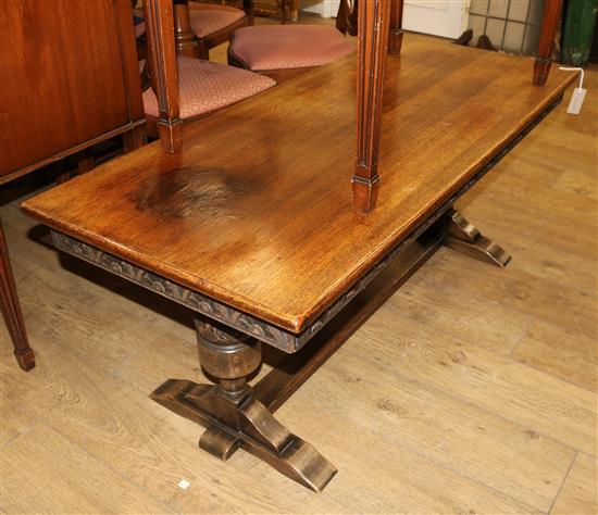 A reproduction low carved oak rectangular topped coffee table W.132cm